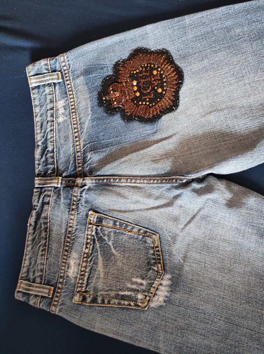 Spodnie damskie jeansowe przetarcia M