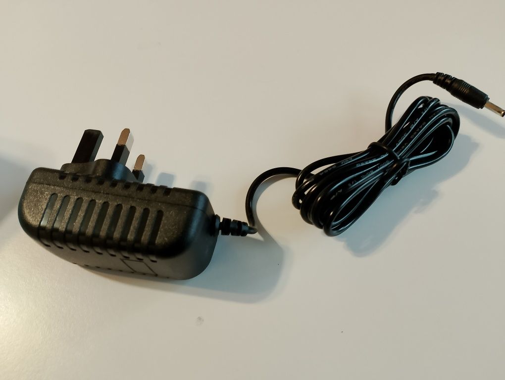 Zasilacz AC/DC ADAPTER YHSW-090100V 9V 1A plus ładowarka do szczoteczk