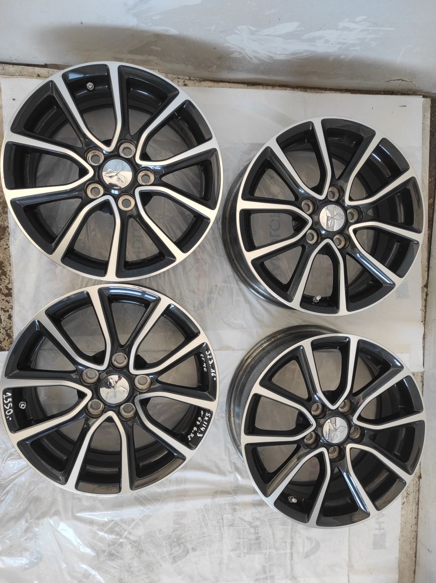 323 Felgi aluminiowe ORYGINAŁ MITSUBISHI R 16 5x114,3 otwór 67 B. Ładn