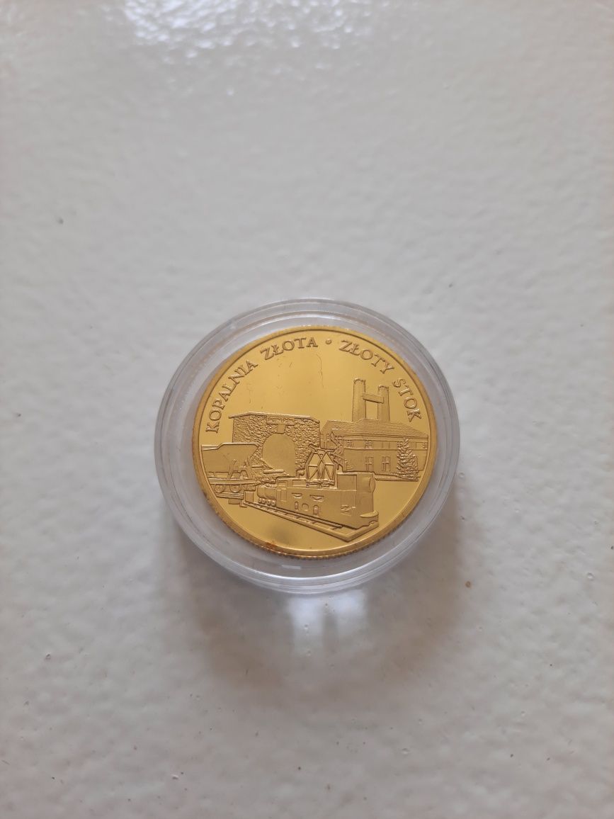 Złota moneta pamiątkowa z kopalni złota w Złotym Stoku