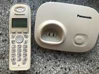 Telefon bezprzewodowy stacjonarny Panasonic ze stacją bazową i zasil.