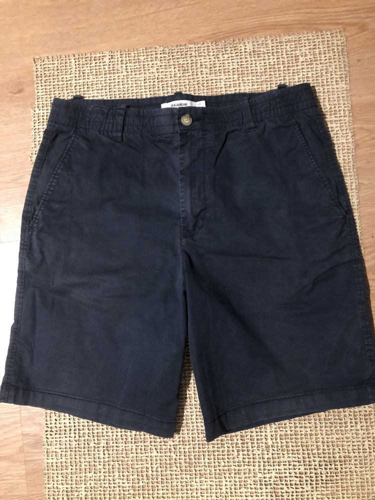 Calções com bolsos laterais e atras,, elastico na cintura