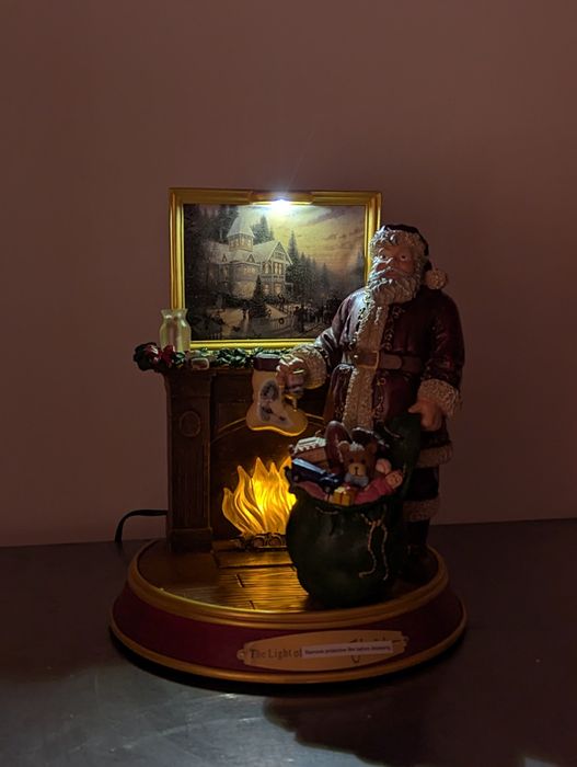 Świąteczna figurka Światło Bożego Narodzenia św Mikołaj Thomas Kinkade