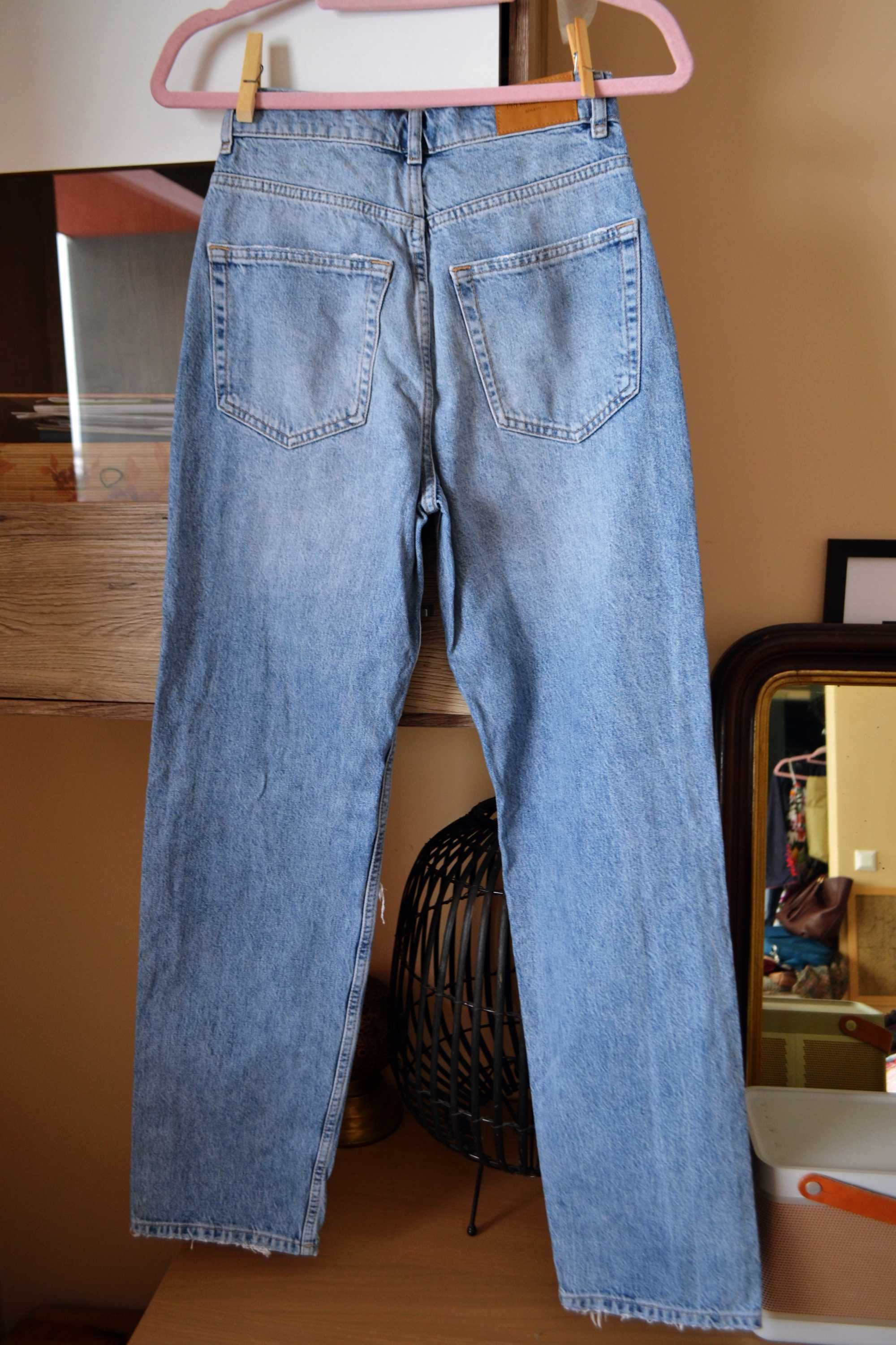 Jeansy dźinsy z wysokim stanem jasne z dziurami przetarcia 34 jeans