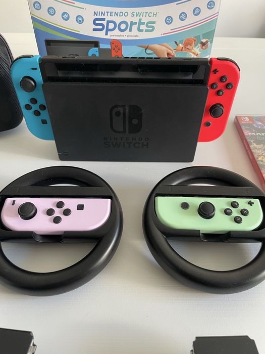 Nintendo Switch c/ 3 jogos, 4 comandos e bolsa transporte