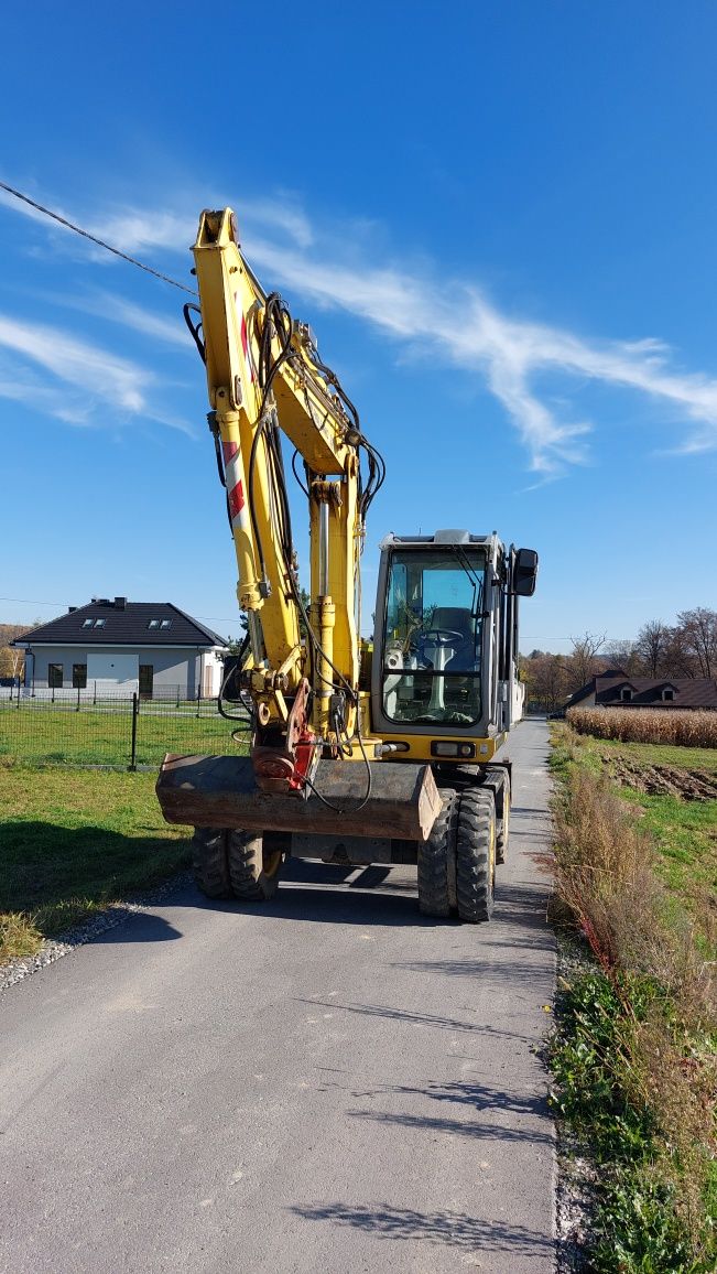 Wynajem koparki kołowej NEW HOLLAND MH 2.6 wypożyczenie koparki 10Ton