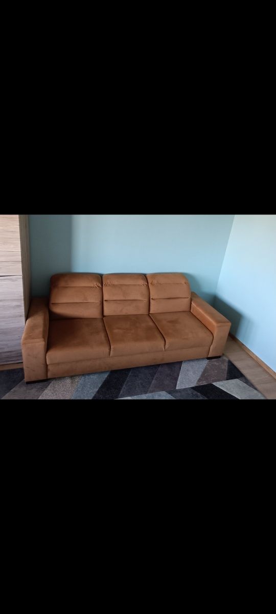 Kanapa sofa z funkcją spania i pojemnikami na pościel w boczkach