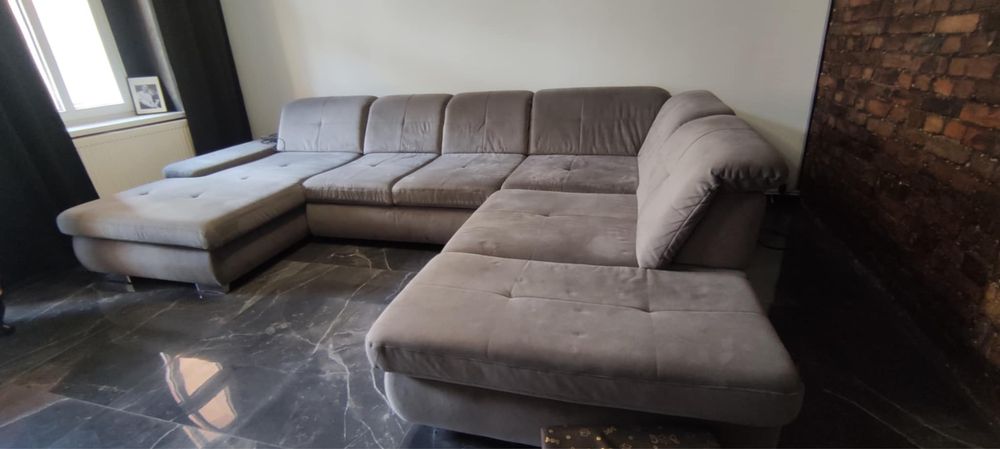 Narożnik kolorze szarym z funkcją spania