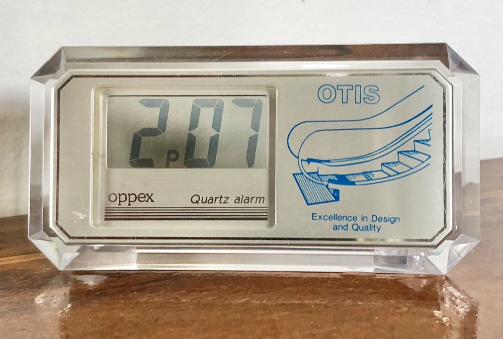 Retro zegarek budzik LCD kwarcowy Oppex reklama OTIS przeźroczysty vtg