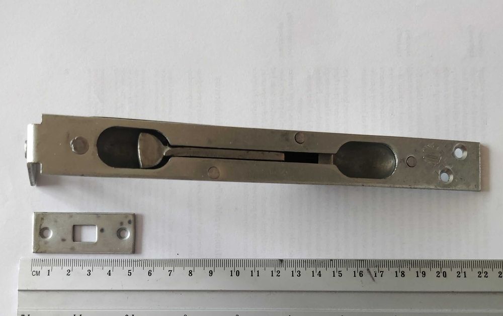 Rygiel do drzwi wpuszczany, stalowy, ocynk. Zasuwa kozłowa.