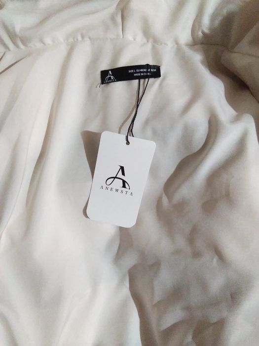 Przytulne ciepłe futerko (krótkie) iż głębokim wygodnym kapturem