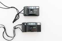 2x aparat na kliszę Panasonic C-520AF oraz Minolta AF-E