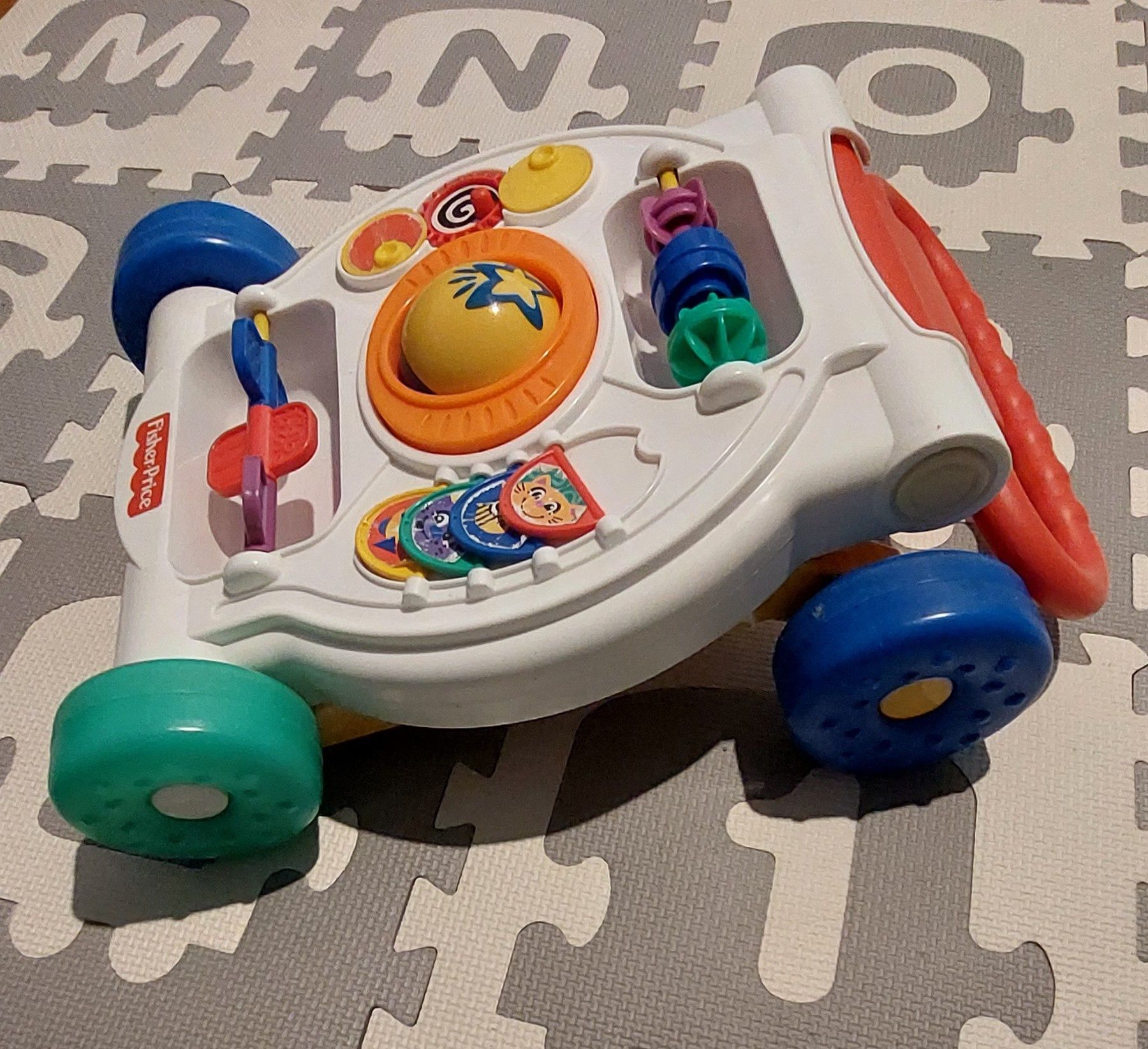 Pchacz, chodzik, jeździk Fisher Price