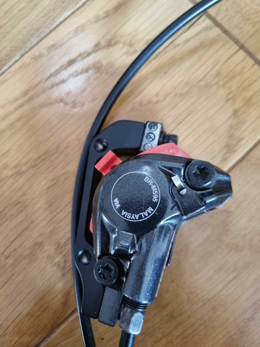 Hamulec tarczowy Shimano M595 tył nieużywany DEORE