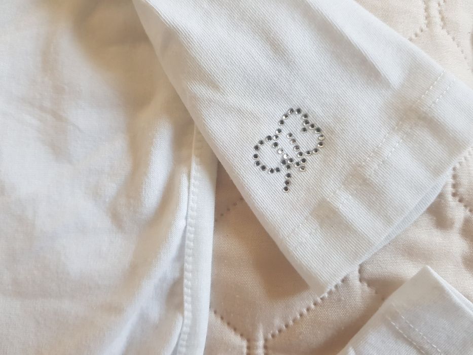 Dzieninowe, białe bolerko dziewczęce z aplikacją