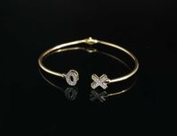 Złoto 585 - złota bransoletka BANGLE X O