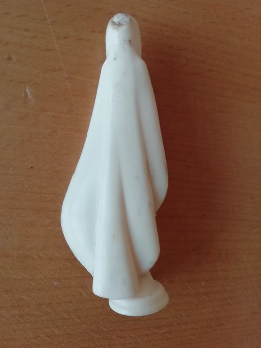 Santa para tablier de automóvel e crucifixo.