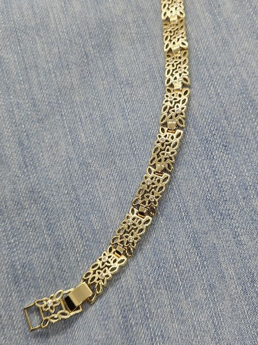 Bransoletka ażurowa kwistki z cyrkoniami stylizowana na Apart kolor zł