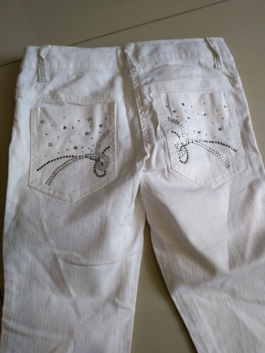 Spodnie dziewczęce białe Next 140cm 9-10 lat jeans nogawka 3/4
