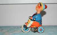 Заводная игрушка из жести: Мальчик на велосипеде, Фирма Kovap