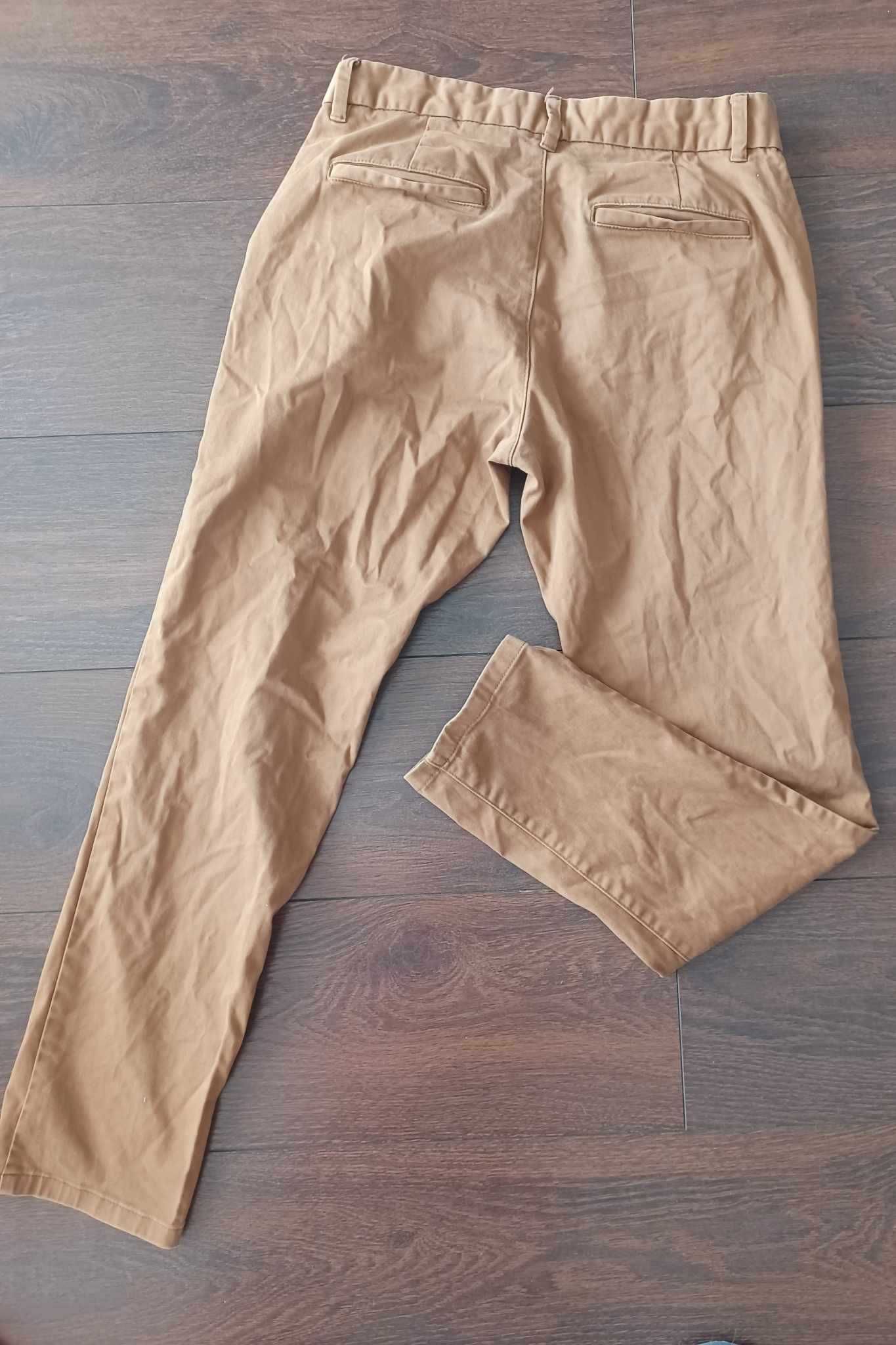 Długie bawełniane spodnie męskie NEXT 30 (S/M) slim fit / musztardowe
