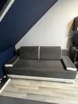 Biało-szara sofa rozkładana