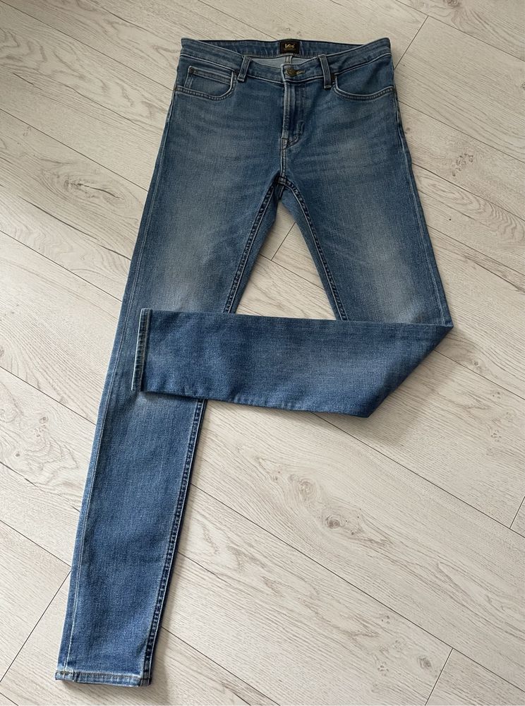 Niebieskie bawełniane meskie spodnie jeansy skinny Lee W30 L34