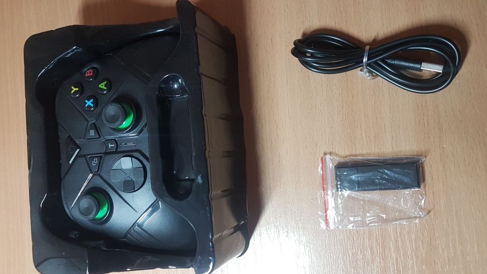 Продам новый беспроводной геймпад с адаптером