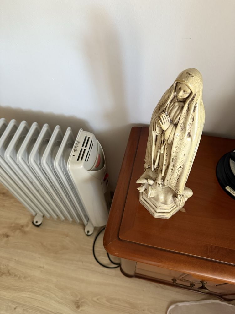Imagem da nossa senhora de Fatims em pedra como nova