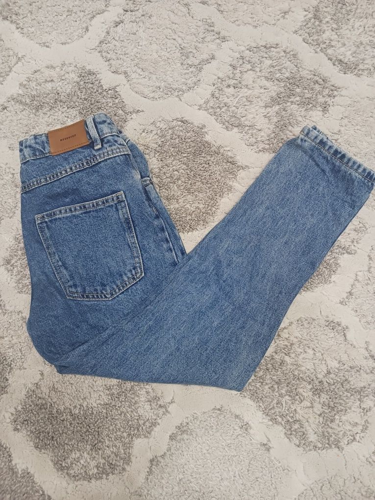 Spodnie jeans dziewczęce z dziurami roz 146 Reserved