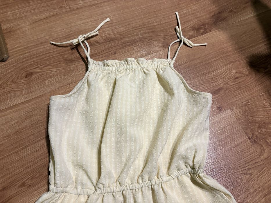 H&M kombinezon dziewczęcy żółty wiązany lato krótka nogawka 152