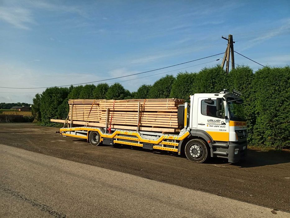 Pomoc drogowa transport maszyn  laweta autolaweta usługi transportowe