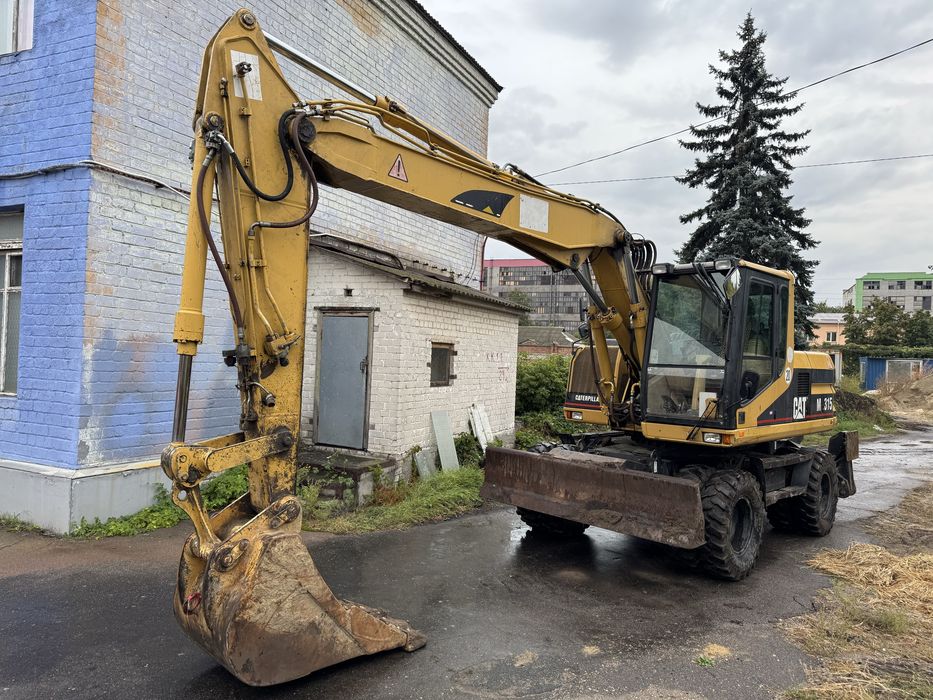 Колісний повноповоротний екскаватор CATERPILLAR M315 (CAT M-315)