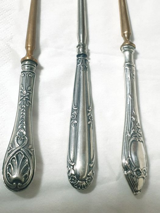 Antigas abotoadeiras com pega em prata contrastada -  Preço cada 35€