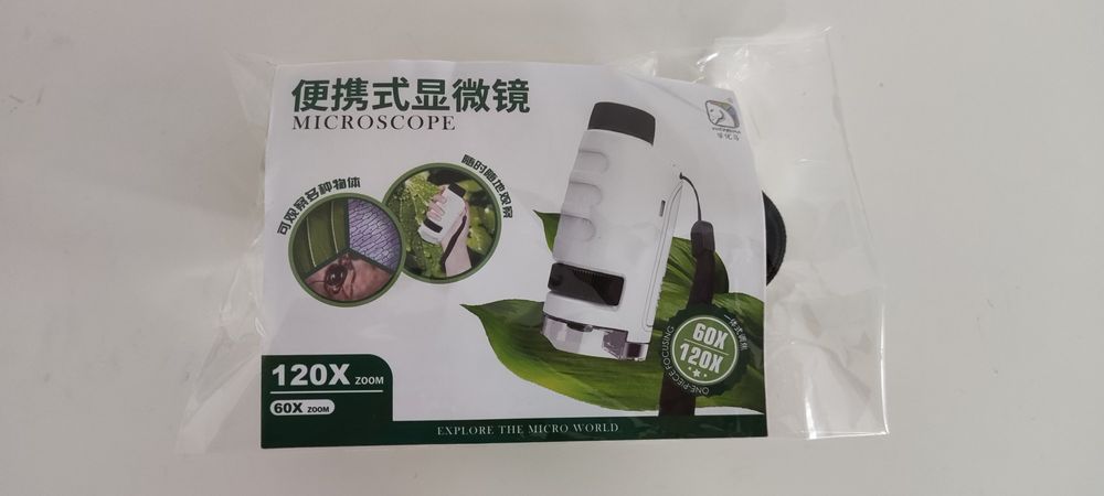 Microscópio de bolso novo