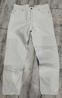 Białe jeansy Reserved