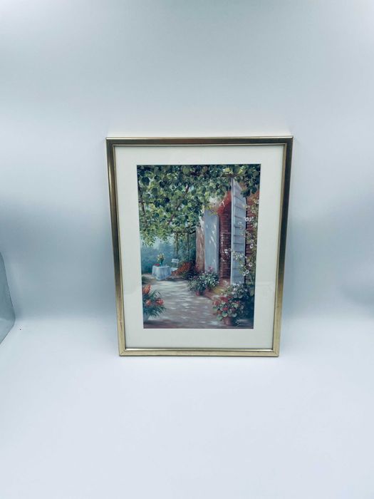 Grafika w ramce złoconej przedstawiająca wyjcie na ogród.