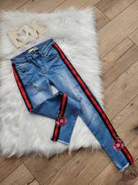 Spodnie dżinsowe jeansy haftowane kwiaty lampasem xs