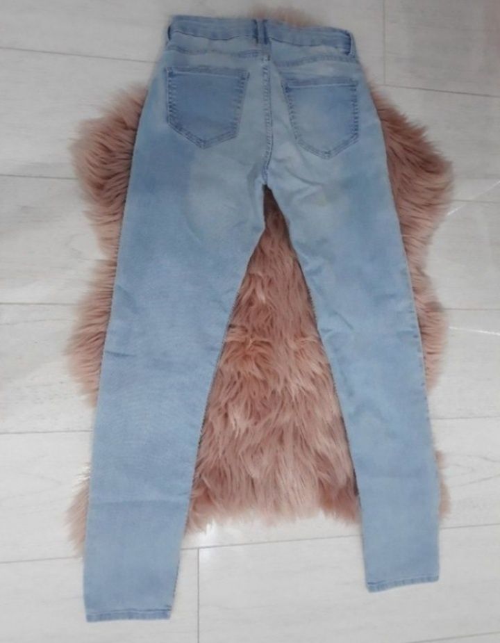 Spodnie damskie jeansy jeansowe dżins jasne niebieskie rurki H&M XS 34