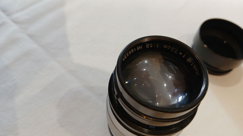 Objetiva LEICA Hektor 7,3 cm. c/ tampa e parasol