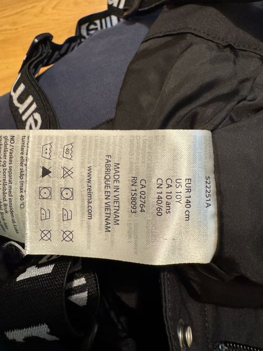 Przeciwdeszczowe ocieplane spodnie Reima Tiksi r140