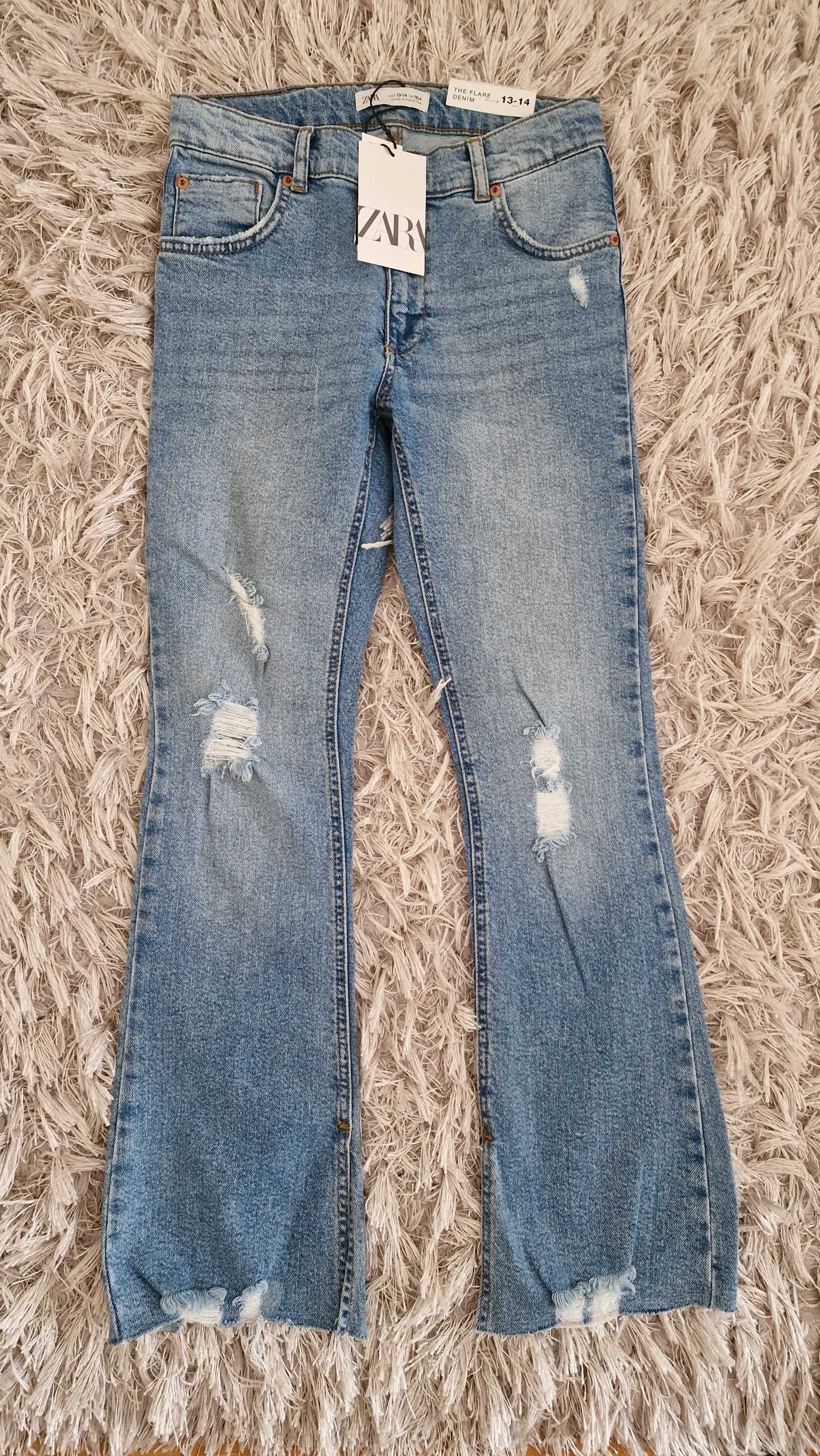 Zara spodnie jeansy flare z przetarciami / rozdarciami 164 cm zara