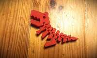Zabawka dinozaur tyranozaur ruchomy brelok fidget toy czerwony