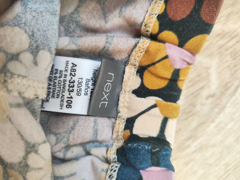 Next legginsy jesienne 128 kwiaty rude zielone długie elastyczne
