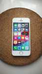 Telefon srebrny biały Apple iPhone bez blokad 12.5.7