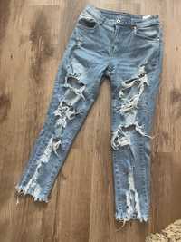 Spodnie jeansy dżinsy dziury rozdarcia przetarcia