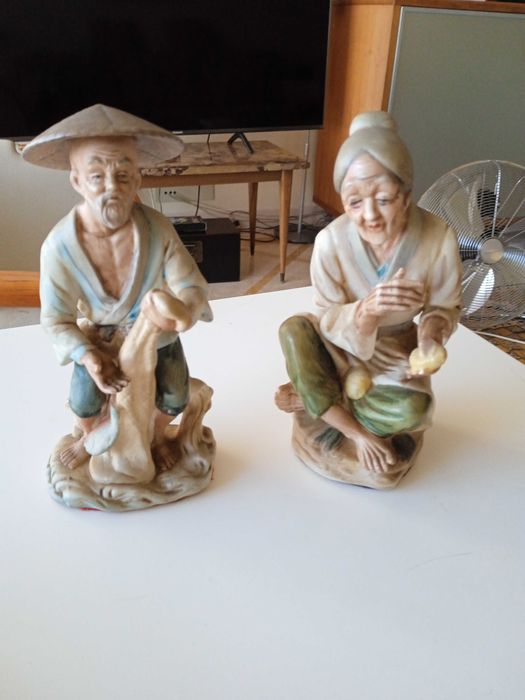 Casal de camponeses chineses em biscuit