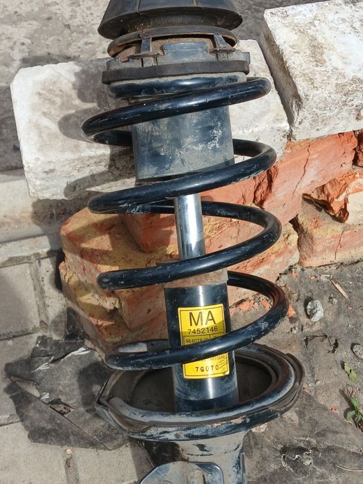 Передня стійка [амортізатор] шевроле лачети.