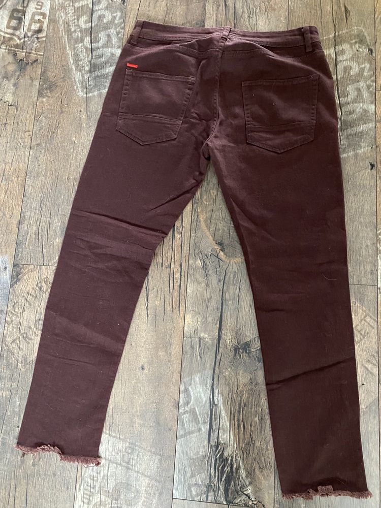 Spodnie jeans Castro z rozdarciem  rozmiar 32/L