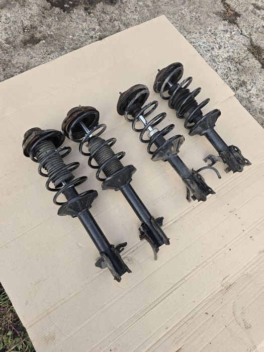 Стойки в сборе Nissan Sunny N14 91-96 левая правая передняя задняя